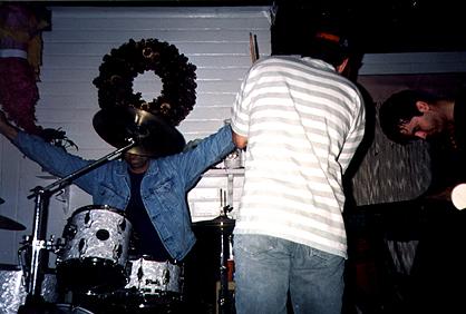 This one cracks me up.  Neal's face is obscured by a cymbal, but the full 'Neal' pose.  Notice Kevin *plastered* on the side.